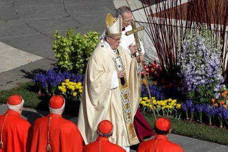 Pope Francis walks with the pastoral staff as he arrives to celebrates the Easter mass in St. Peter’s Square at the Vatican. (AP Photo/Gregorio Borgia)