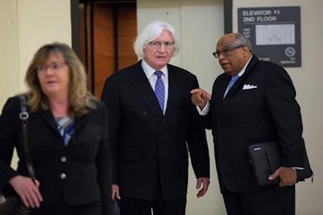 Attorney Tom Mesereau, center, attorney for Bill Cosby, arrives at the Montgomery County Courthouse, in Norristown, Pa., for the sexual assault trial of Bill Cosby, Tuesday, April 24, 2018. (Jessica Griffin/The Philadelphia Inquirer via AP)